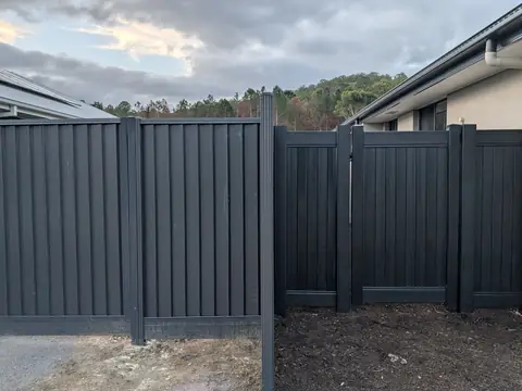 Charcoal panel fence and gate between two homes